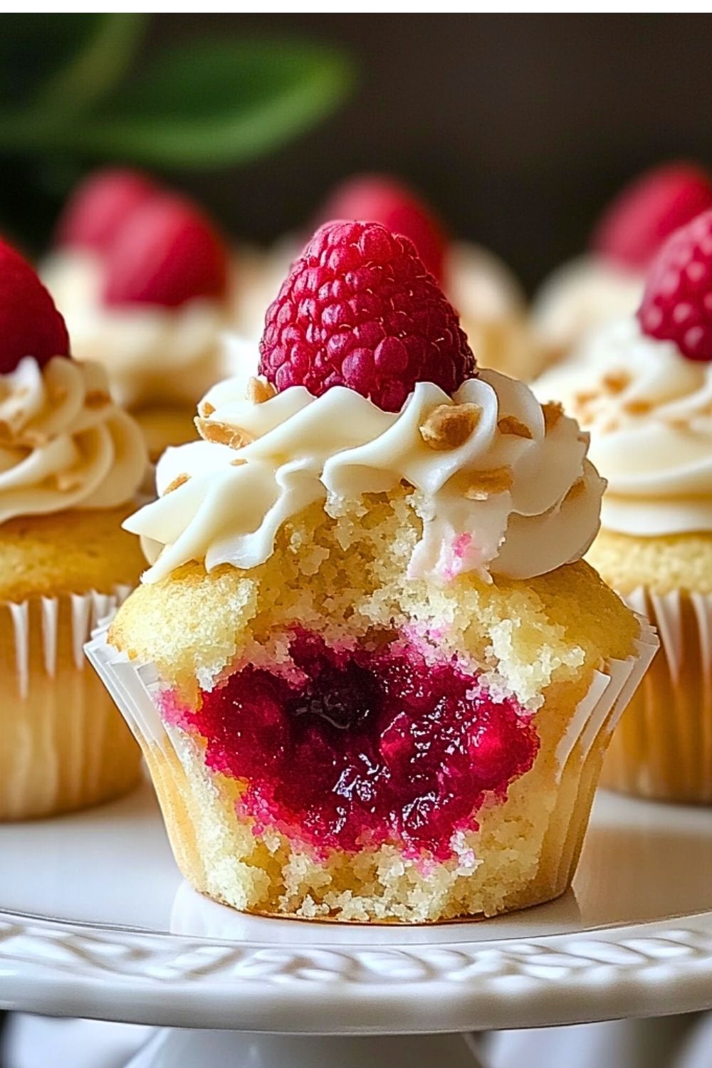 Almond Wedding Cake Cupcakes with Raspberry Filling