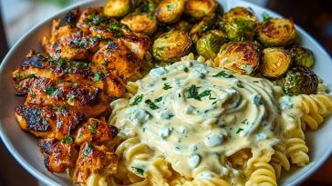 Hot Honey Cajun Chicken Alfredo with Basil Feta Swirl & Crispy Brussels Chips