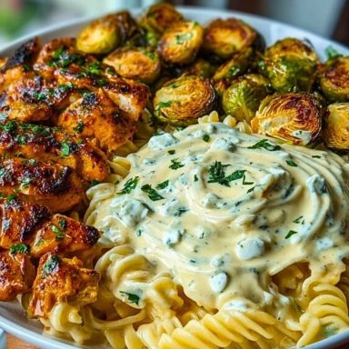 Hot Honey Cajun Chicken Alfredo with Basil Feta Swirl & Crispy Brussels Chips