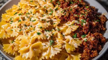 Cheesy Bowtie Pasta with Savory Cajun Ground Beef in Garlic Cream