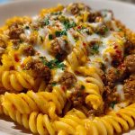 Creamy Mozzarella Rotini with Spicy Cajun Beef and Velveeta Sauce